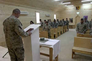 A U.S. Navy chaplain leads a church service in Iraq in 2005 (public domain photo via U.S. Marine Corps)