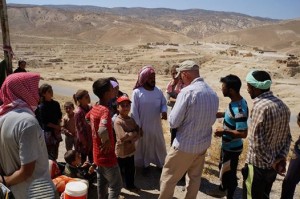 Yazidi refugees and American aid workers on Mount Sinjar in August 2014 (public domain image via USAID)